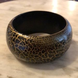 Stylish hand-painted animal-print wood cuff bracelet from India. Black w/ gold.